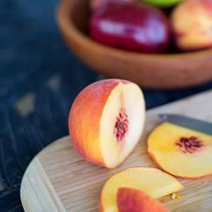 fruit club with sliced fruit on cutting board